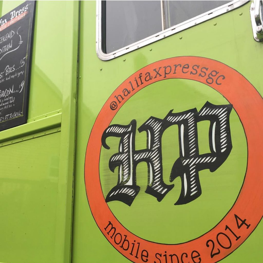 Halifax Press logo icon on the side of the lime green food truck.